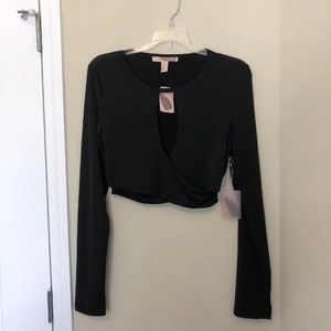 New with tags. Black long sleeve keyhole crop top